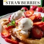 A plate of waffles topped with macerated strawberries, two scoops of ice cream, mint leaves, and a "Not Entirely Average" label.
