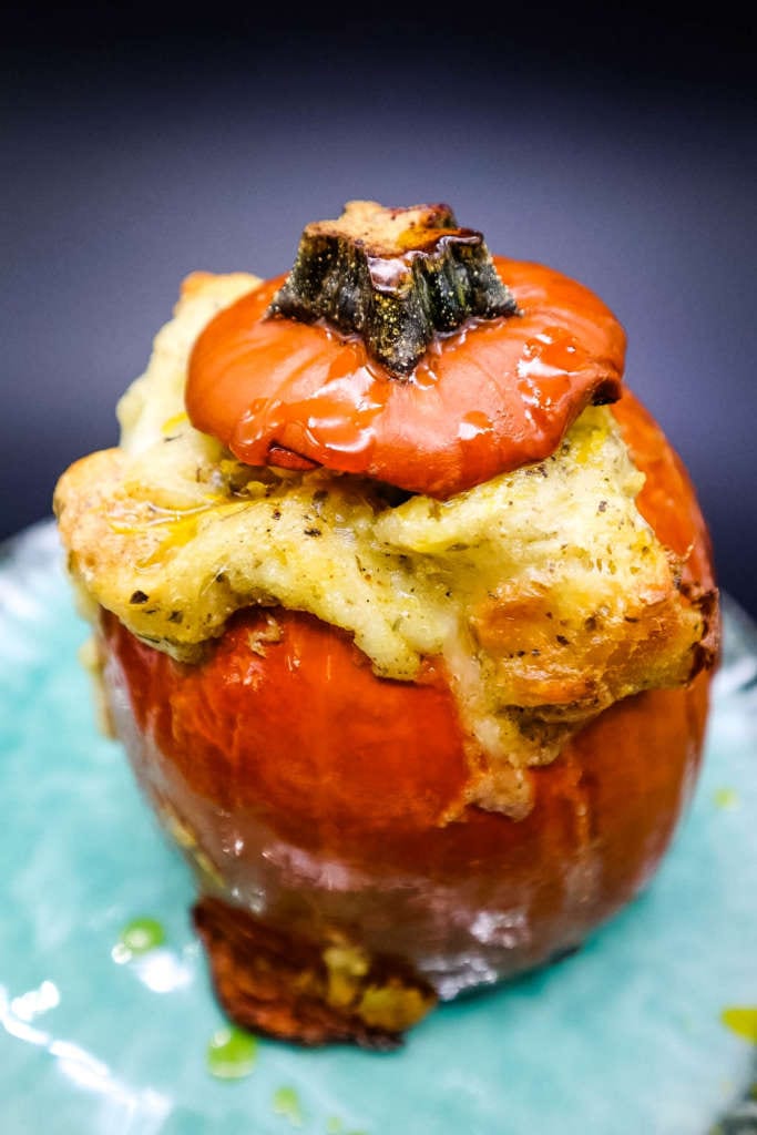 a baked sugar pumpkin, with stuffing and cheese