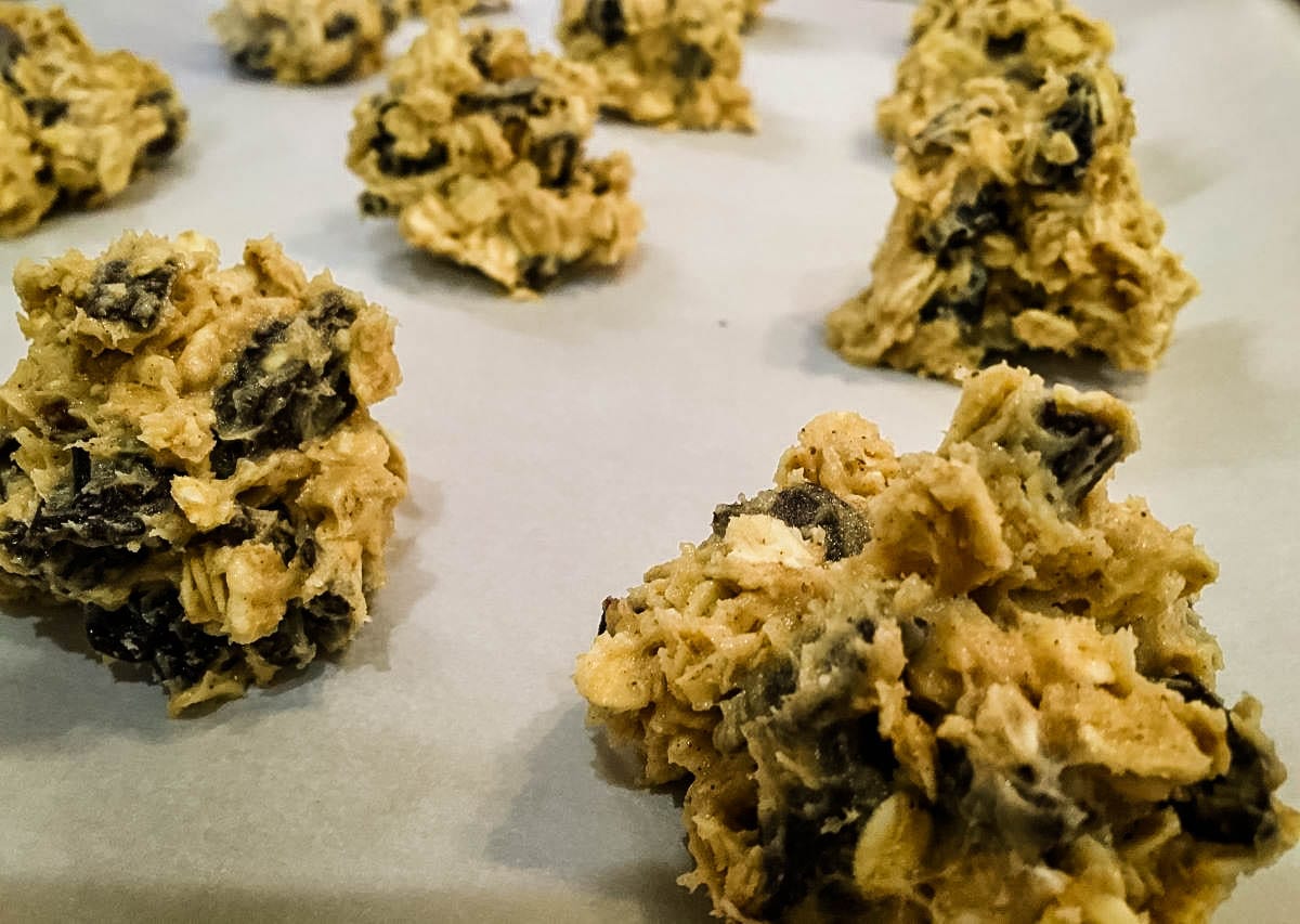 raw cherry chocolate chunk oatmeal cookies dough on a baking sheet