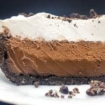 A big slice of chocolate pie showing the four layers of unique chocolate flavors.