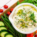 A bowl of dip, with Garlic