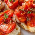 Lots of whipped feta appetizers crowded onto a serving platter.