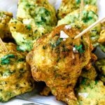 A plate of food with zucchini, with Fritter