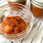 jars of homemade peach, strawberry and maple jam
