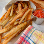 close up photo of Crispy Oven Fries, with Ketchup