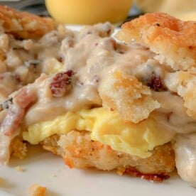 close up of biscuits with eggs and gravy