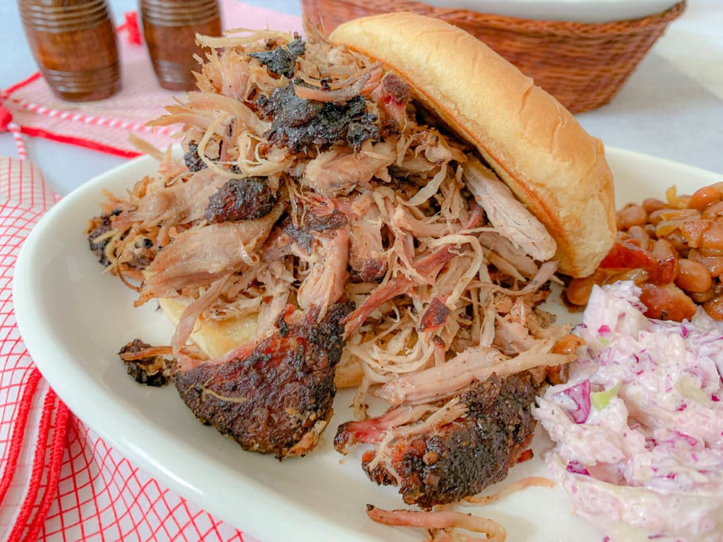 meat sandwich on a plate, with beans