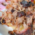 close up of a meat sandwich on a bun