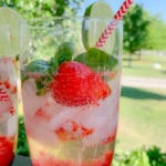 close up of a glass with strawberries, with gin