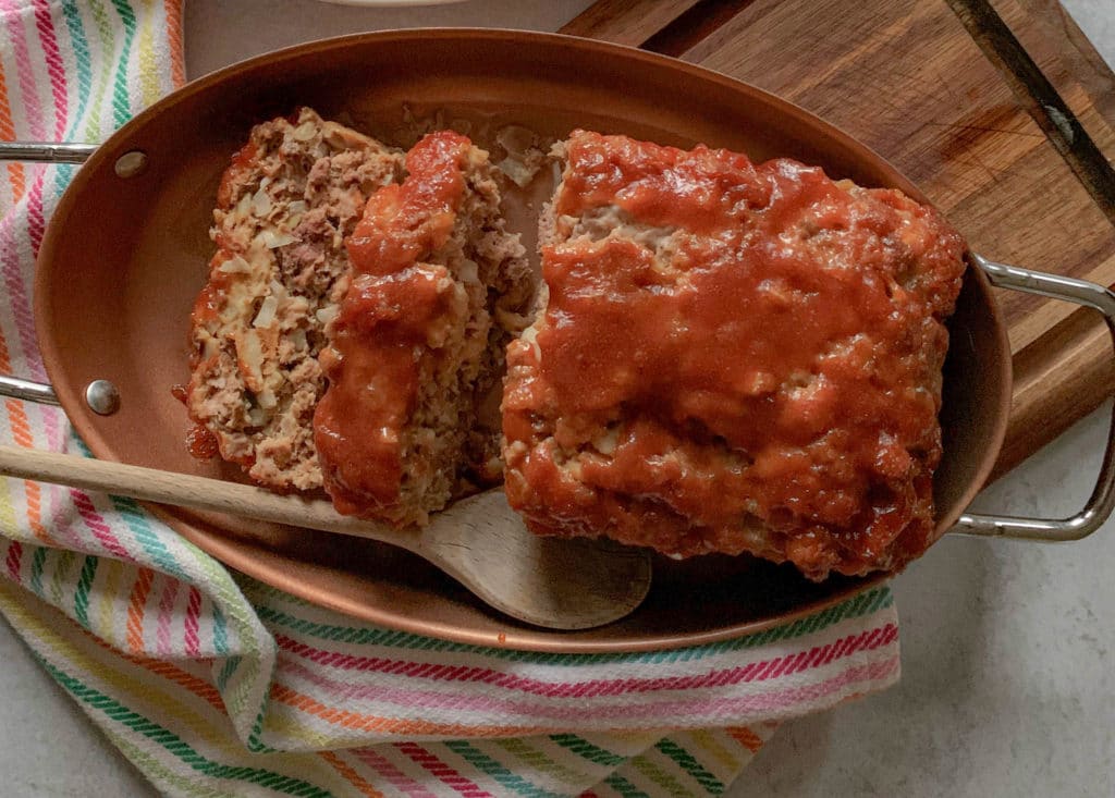 a meatloaf, with a spoon