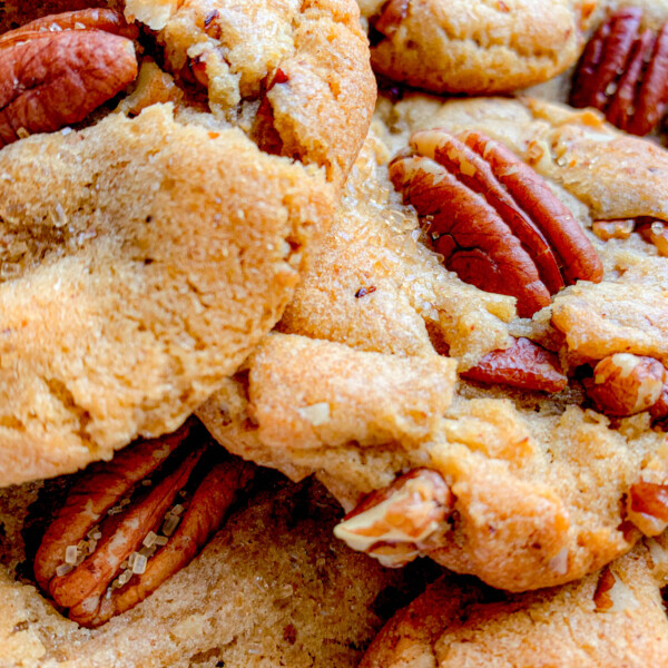a red plate, piled with Butter Pecan Cookies