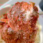 a fork, with a big meatball on the end