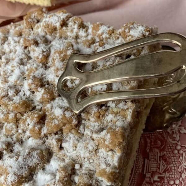 A slice of New York style crumb coffee cake.