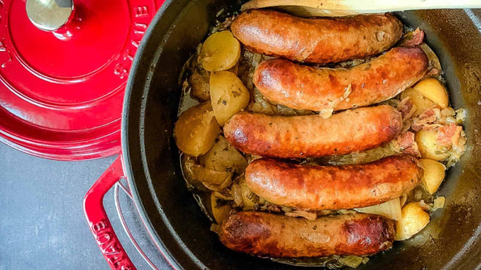A Dutch oven filled with Irish pork sausage and potato stew.