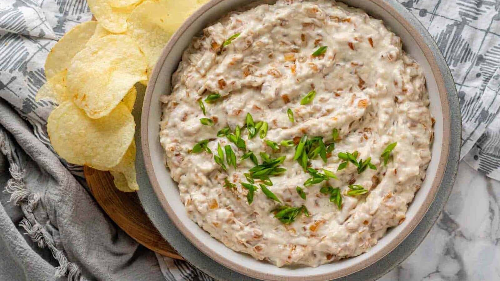 Dip in a bowl garnished with sliced green onions.