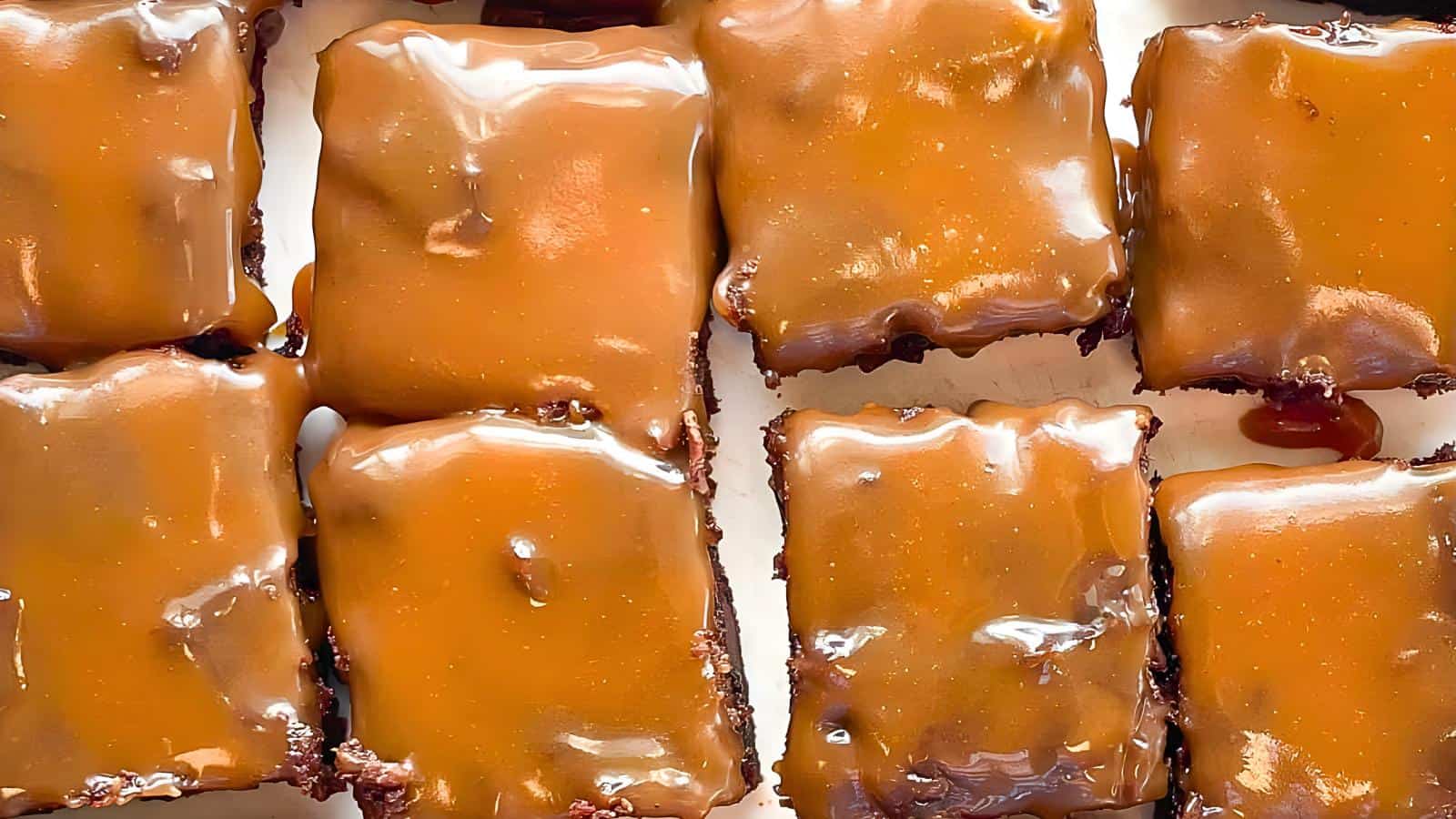Brownies drizzled with caramel, arranged in a grid pattern.