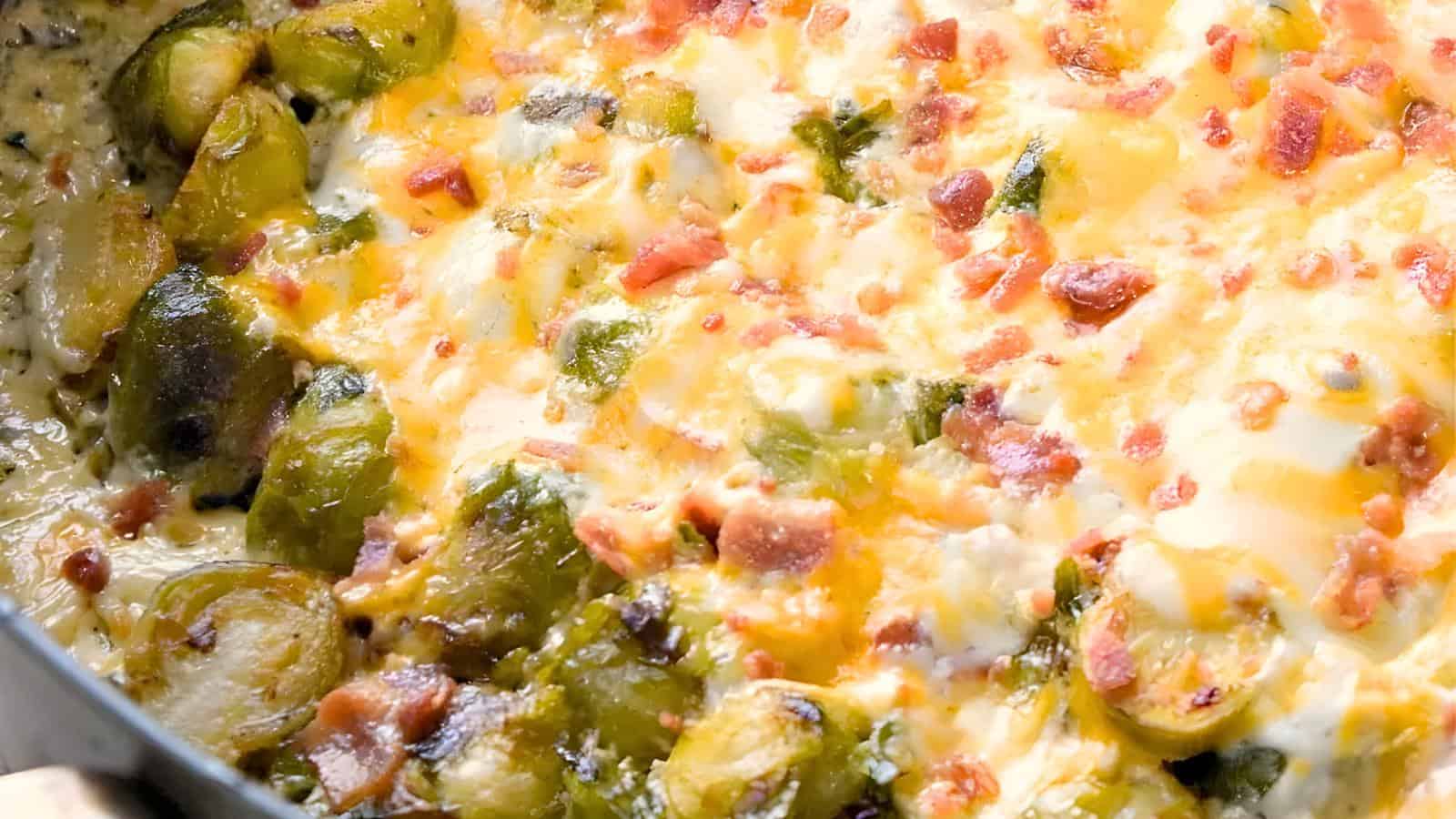 Brussels sprouts topped with melted cheese and crumbled bacon.