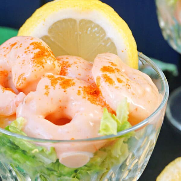 A glass bowl with prawn cocktail.