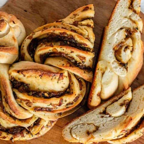 A swirl loaf of bread with slices cut.