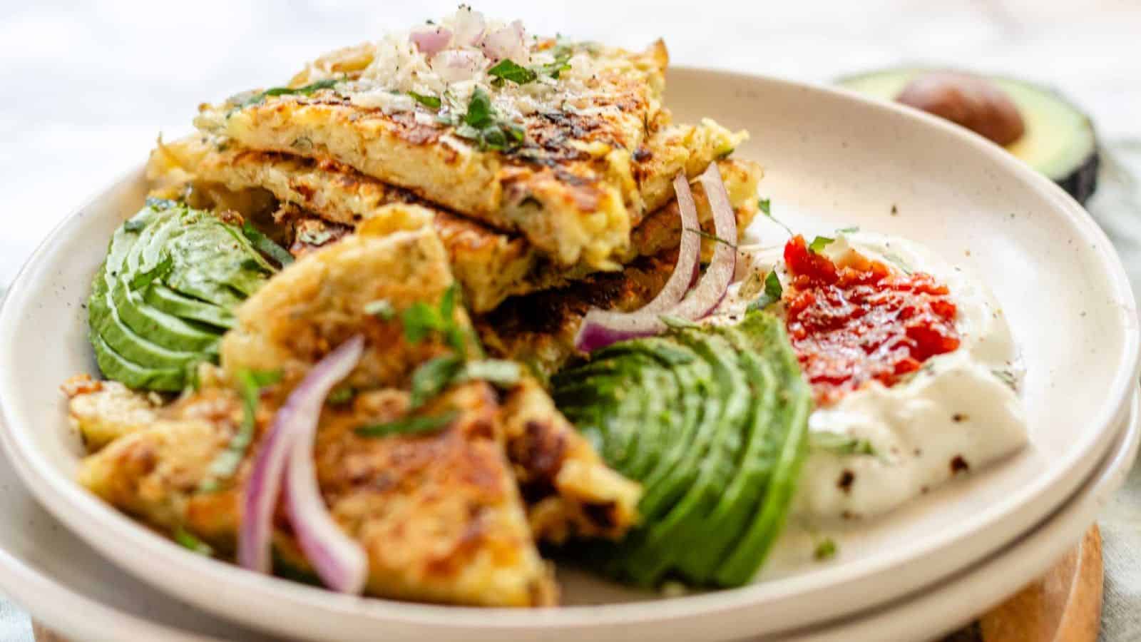 A potato pancake with avocado.