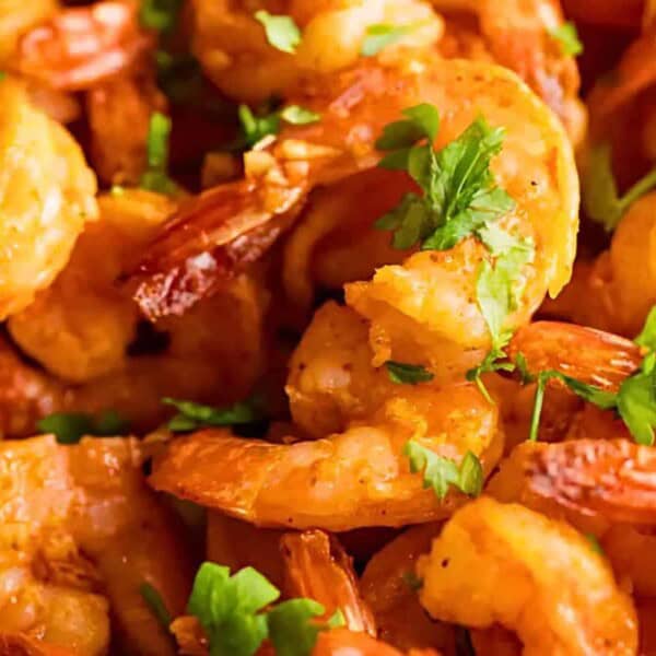 Cooked shrimp with chopped cilantro.