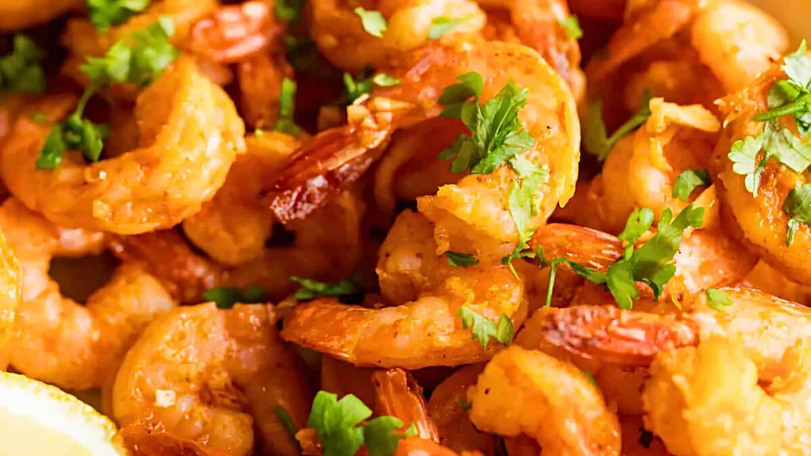 Cooked shrimp with chopped cilantro.