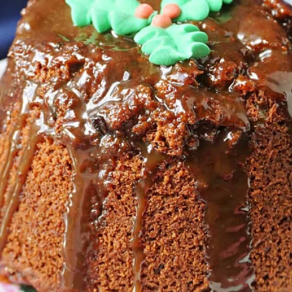 A Christmas sticky toffee pudding on a plate.