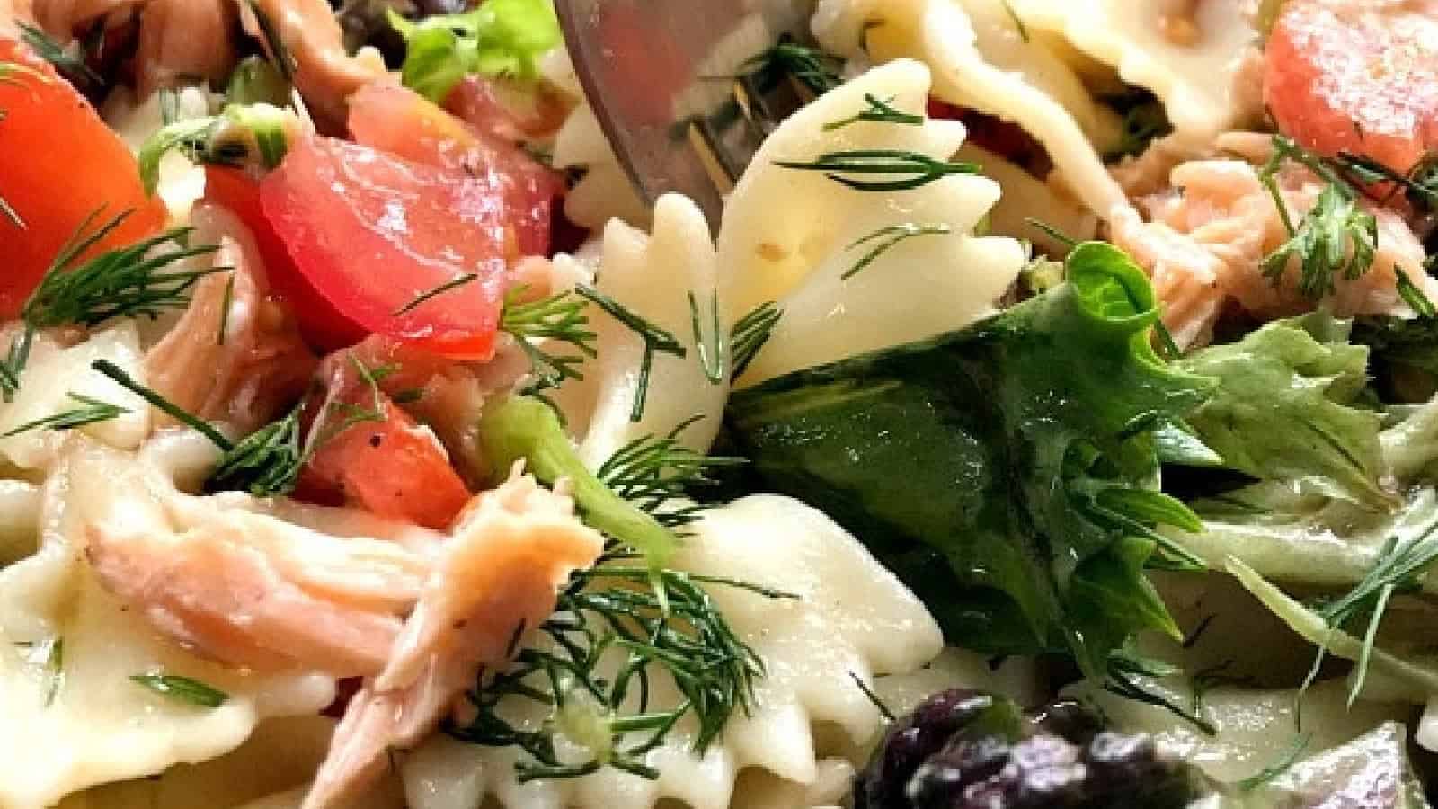 Salmon pasta salad with a fork into it.