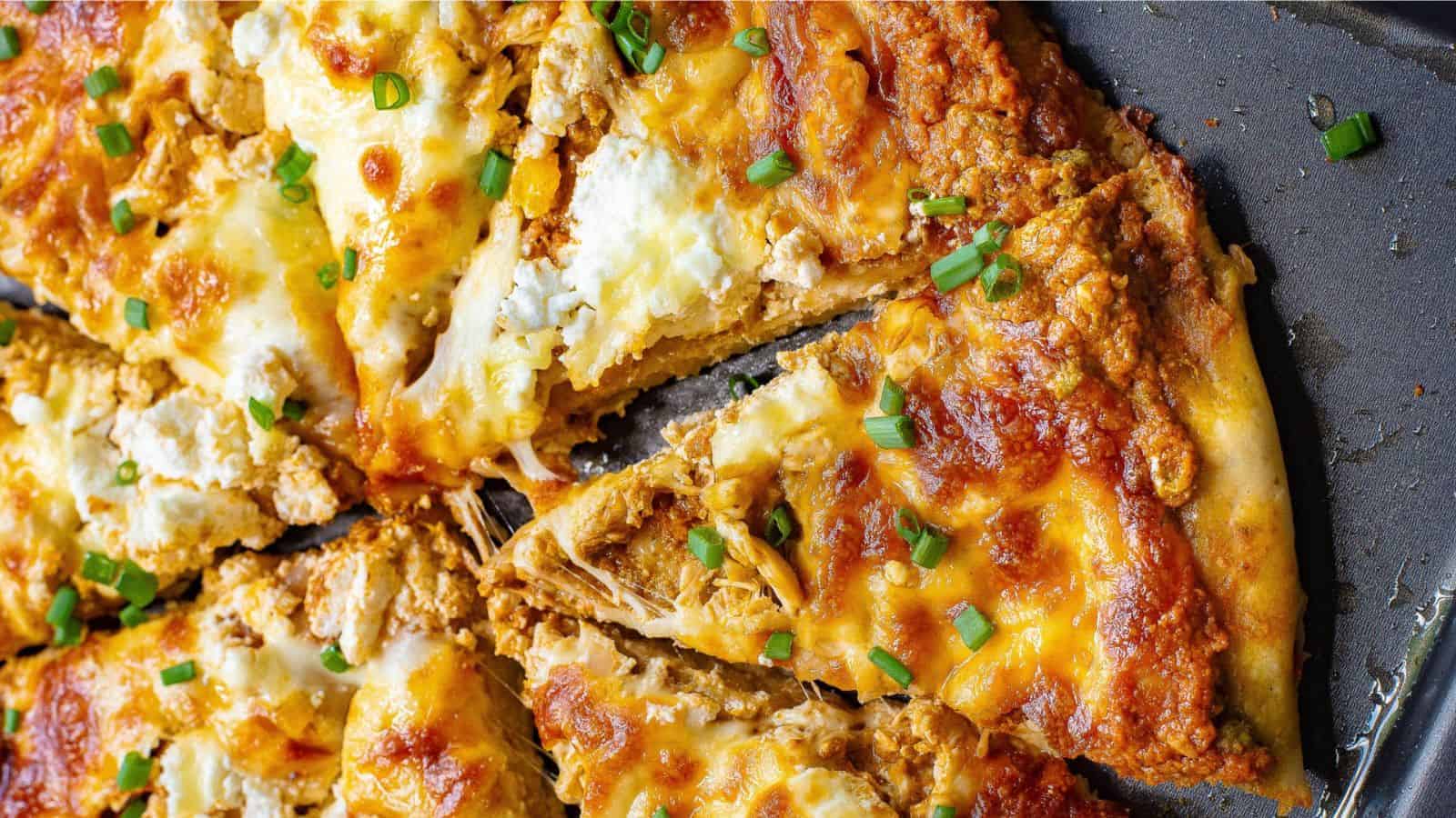 Chicken Pizza loaded with Mozzarella  on a tray.
