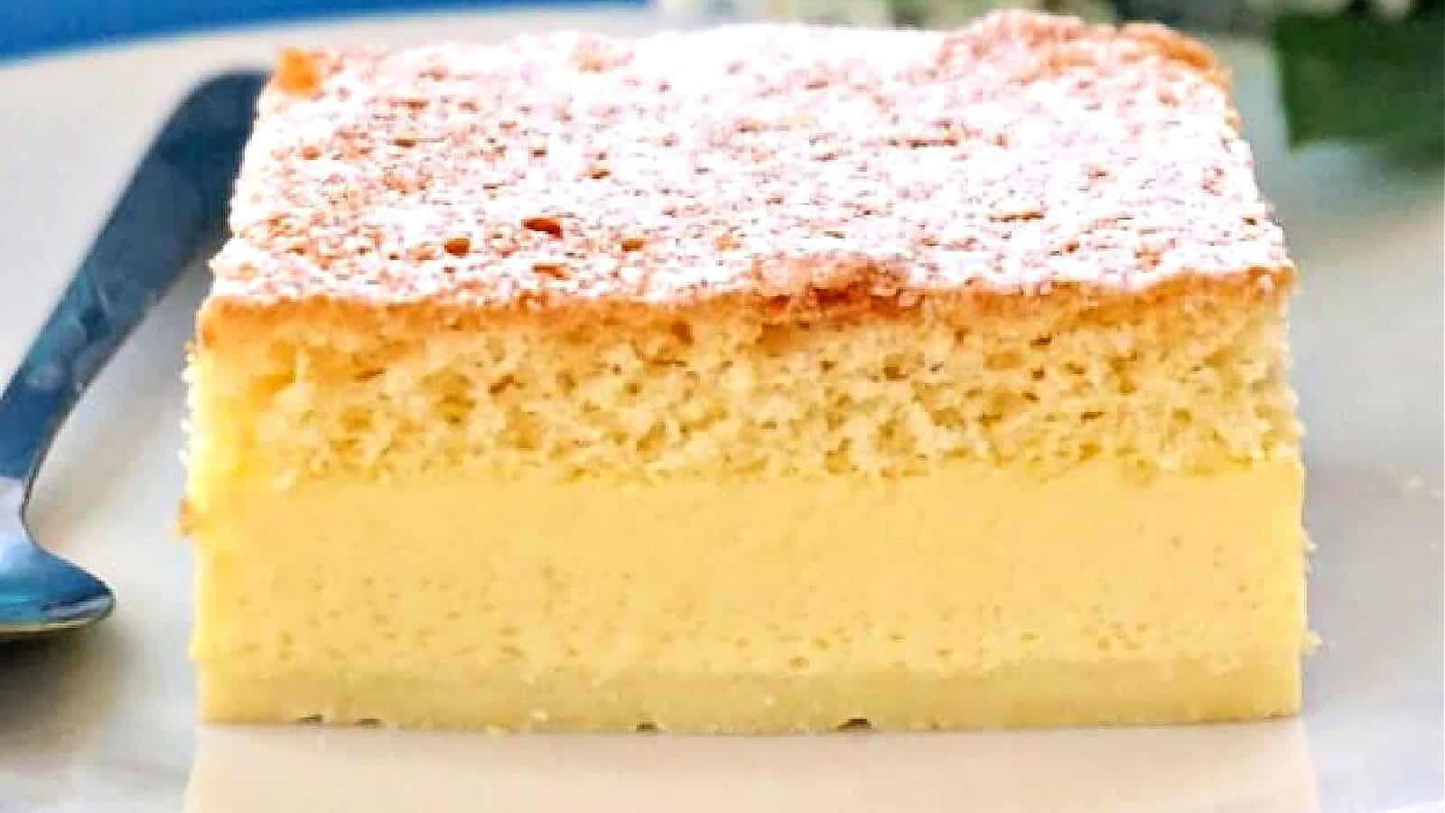 A slice of vanilla magic cake on a plate.