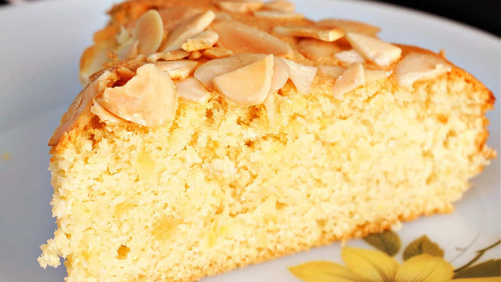 A slice of almond cake on a plate.