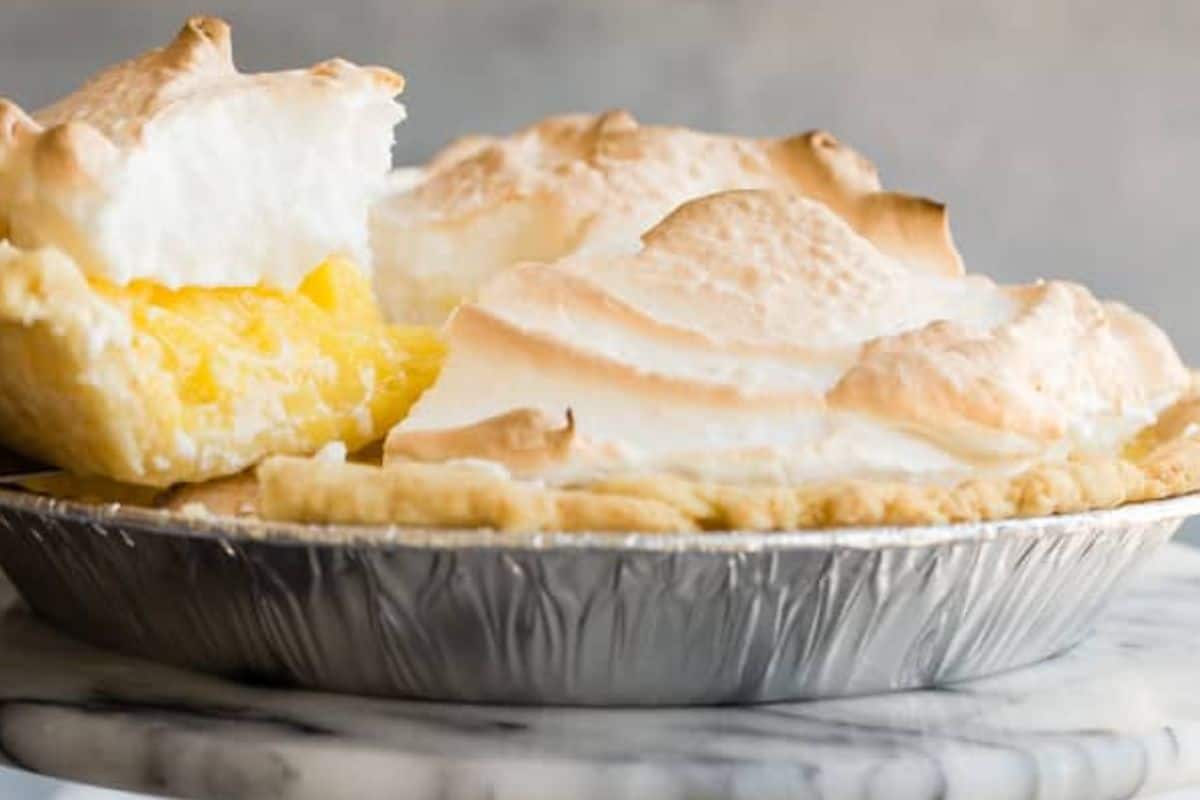 A lemon pie on a pedestal.