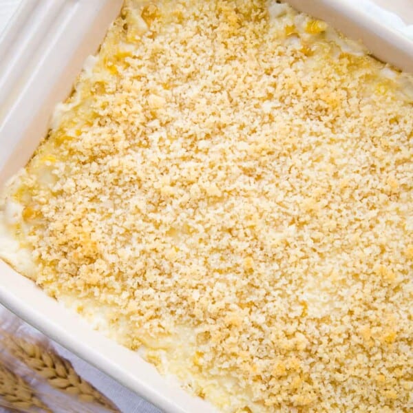 Baking dish containing casserole with a golden breadcrumb topping, viewed from above.