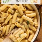 A pot of rigatoni pasta in a creamy sauce, topped with fresh thyme, with a wooden spoon resting inside. Text overlay appears on the image.