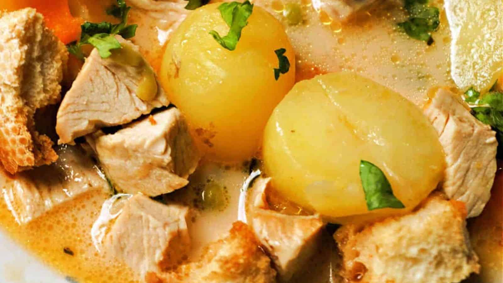 Chunks of chicken, whole baby potatoes, croutons, chopped herbs, and creamy broth.
