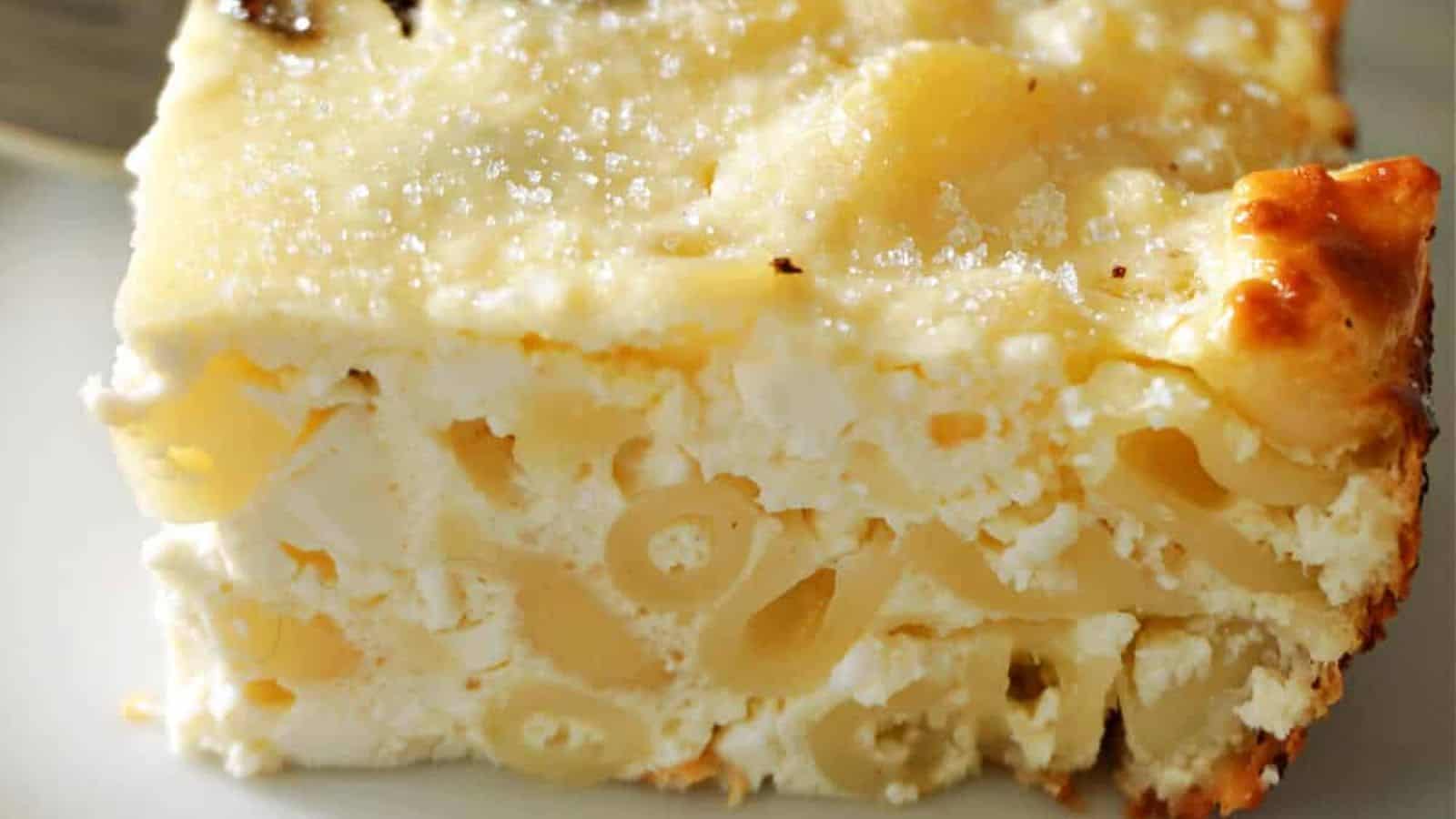 A slice of baked pasta with layered noodles and a golden-brown cheese topping.