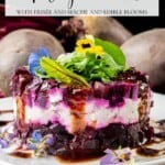Layers of sliced beets and cheese, stacked and topped with frisée, mâche, edible flowers, and a drizzle of dark sauce.