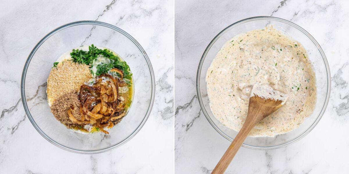 Two glass bowls on a marble surface: one holds chopped herbs, seeds, fried onions, and liquids arranged separately; the other contains a creamy blended mixture being stirred with a wooden spoon.