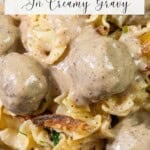 Swedish meatballs coated in creamy gravy, resting on a bed of egg noodles with caramelized onions.
