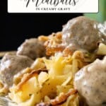 A plate of Swedish meatballs in creamy gravy served over egg noodles with caramelized onions.