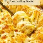 Creamy, golden-brown gratin dauphinois topped with melted cheese and herbs; a serving spoon is lifting out a portion.
