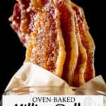 Crispy, caramelized candied bacon slices stacked upright in a glass jar with parchment paper. Text: "Oven-Baked Million Dollar Candied Bacon.